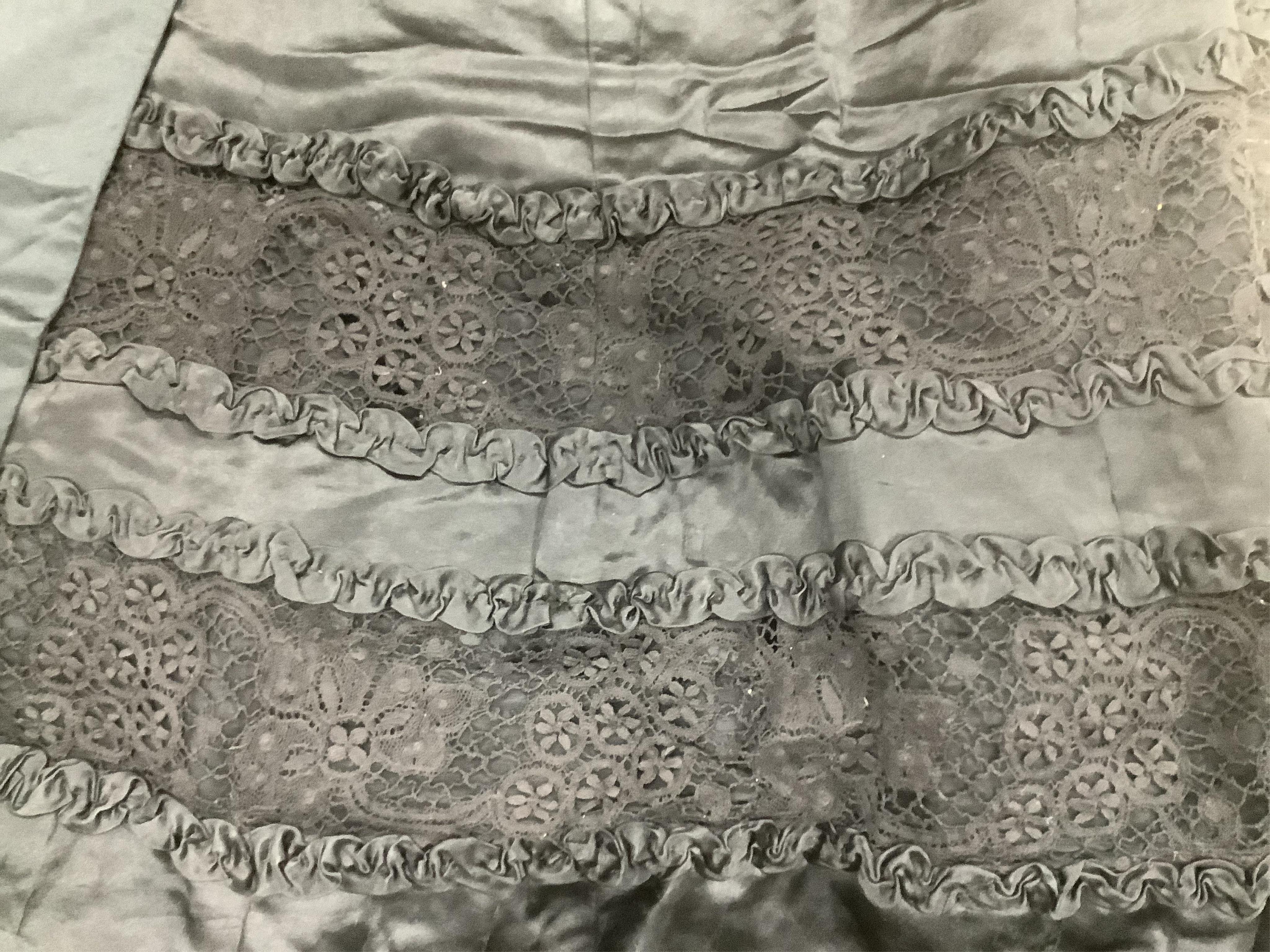Two Edwardian blouses and three earlier lace camisoles, three black satin partly sewn skirts and later black velvet diamonte decorated evening coat. Condition - the coat, skirts and blouses need repair but are good for T